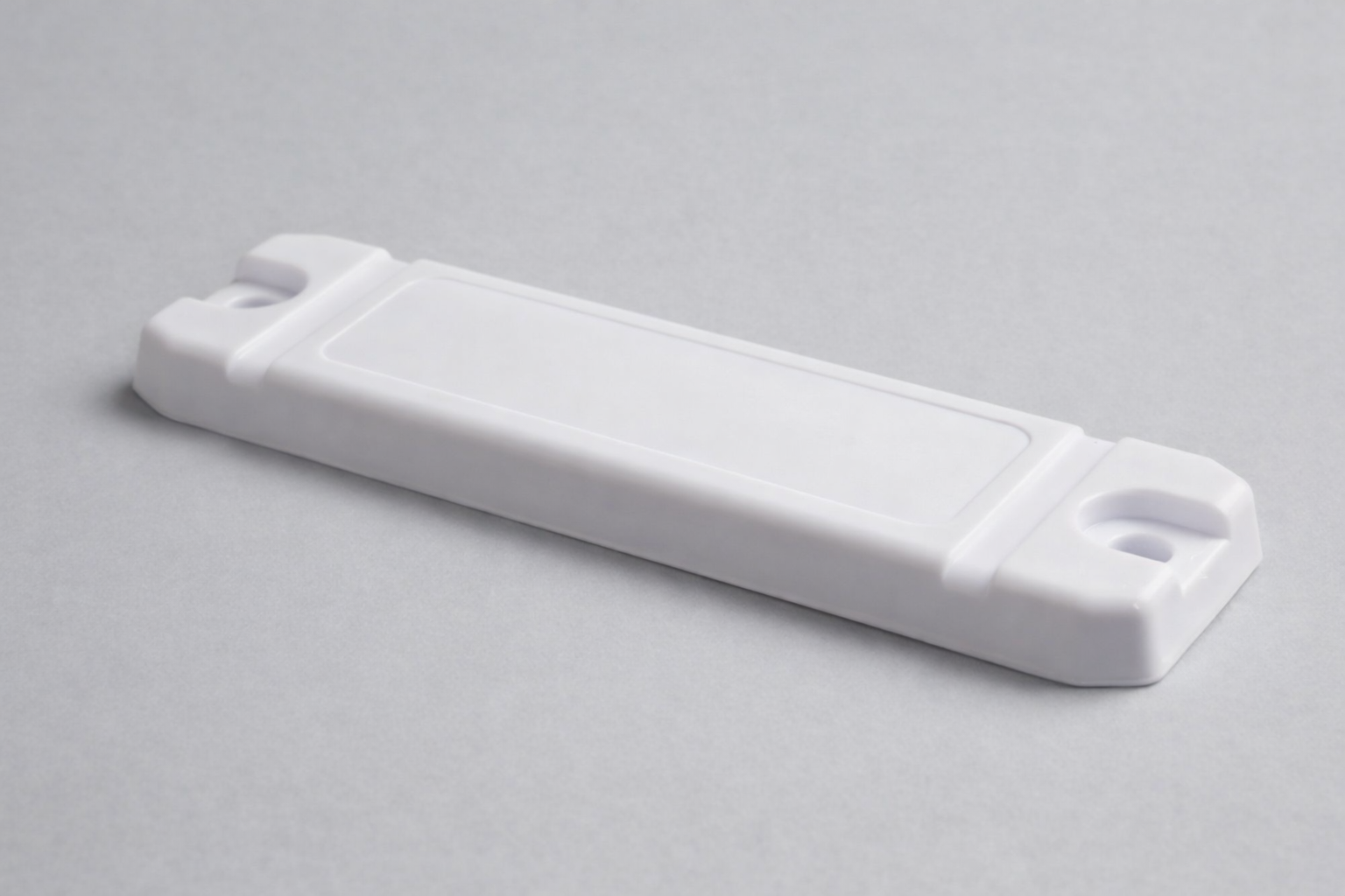 White UHF RFID mid range on-metal tag for industrial applications